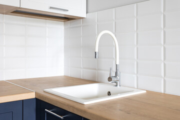 kitchen faucet on a stylish metal sink