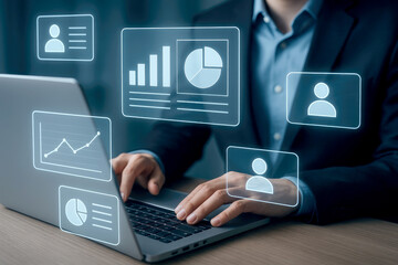 Hands on a laptop with floating digital charts and employee icons representing data analysis technology