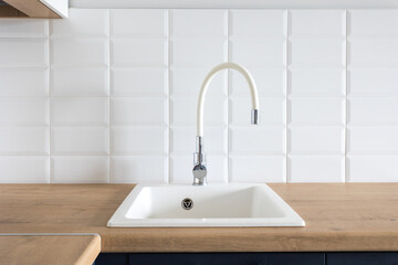 kitchen faucet on a stylish metal sink