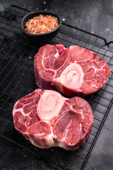 Fresh raw ossobuco Premium veal shank, ideal for slow cooking and creating hearty, comforting meals that impress. black background. top view