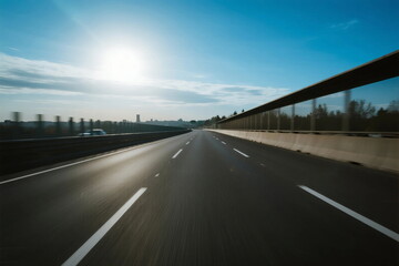 Fototapeta premium Sunny highway with clear blue sky and empty road ahead