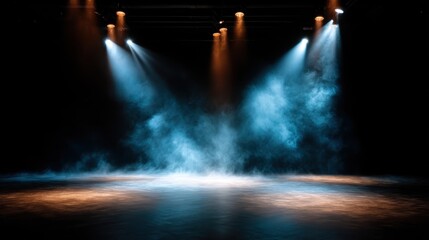 A dramatic view of stage lights illuminating an empty stage, enveloped in fog, creates an atmospheric scene that hints at performance and creativity awaiting expression.
