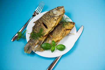 Delicious juicy crucian carp with an appetizing crust, served for dinner