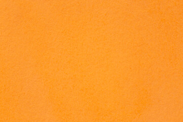 Fototapeta premium blank backdrop for Halloween card: close up of stained in orange color paper texture