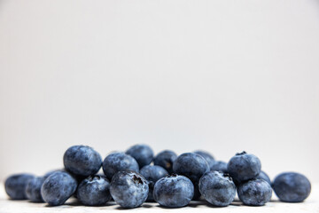 Colorful blueberry fruit that makes a healthy nutricious breakfast or dessert. A closeup shot that shows it's beautifull details. Perfect for a wallpaper or celebration card.