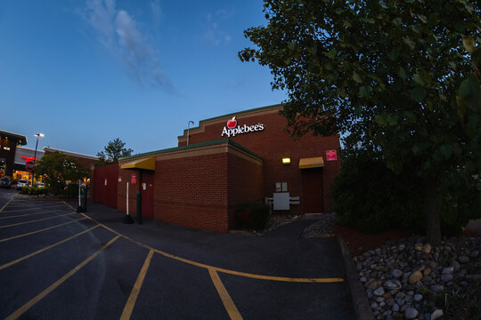New Hartford, NY - Aug 9, 2025: Fisheye view of Applebee's, is an American company, developing franchises, and operates the Applebee's Neighborhood Grill-Bar chain, is a subsidiary of Dine Brands