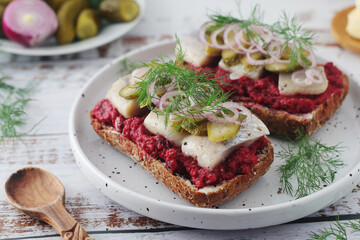 Scandinavian sandwiches with herring and beetroot