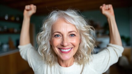 A vibrant image of a joyful senior woman smiling brightly while raising her fists in celebration, embodying positivity and the enjoyment of life during her golden years.