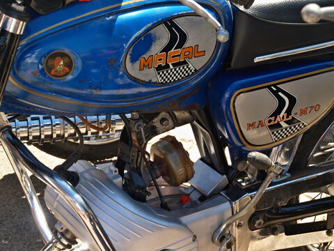 Close-up of a vintage Macal M70 motorcycle showing engine details