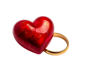 Photo of a red heart with a gold ring on a calendar, symbolizing a special date or event, isolated on white isolated on transparent background