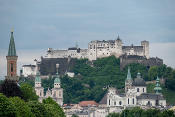 Fototapeta premium Historic old town of Salzburg and Hohensalzburg Fortress atop the Festungsberg hill in Salzburg, Austria