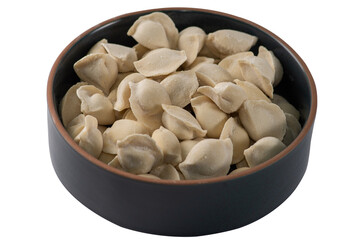 Frozen dumplings semi-finished product piled up decorated with spices on a plate