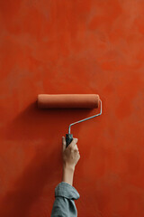 painting a wall with roller