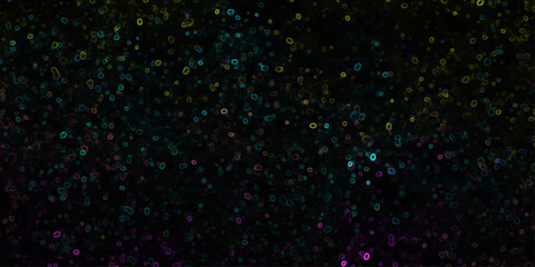Obraz premium Abstract dark background with scattered glowing neon green blue and purple organic shapes and circles
