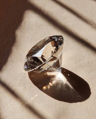 A sparkling diamond on a light beige surface