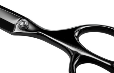 Closeup of sleek black scissors isolated on transparent background, showcasing their sharp blades and ergonomic design, perfect for precision cutting and professional use