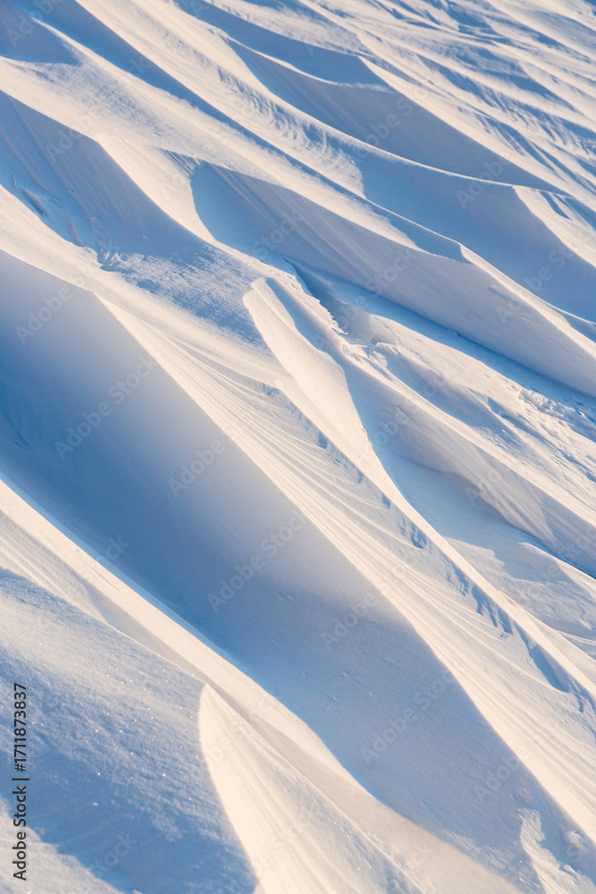 Sticker snow texture. wind sculpted patterns on snow surface. wind in the tundra and in the mountains on the