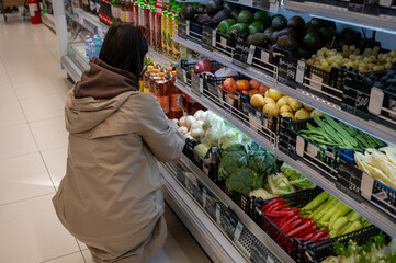 Young Woman in Supermarket Produce Section