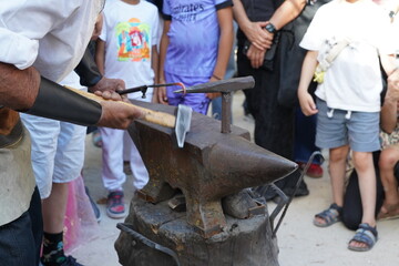 traditional blacksmith handcraft  hammering on anvil