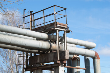 pipeline on concrete supports against blue sky