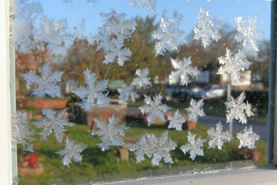 Frost patterns on windowpane, frosty winter scene