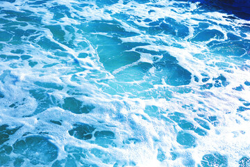 Blue, seething, foamy sea water