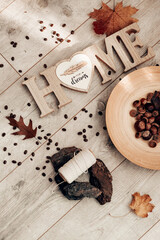 Cozy autumn still life with leaves, acorns, coffee beans, and a 