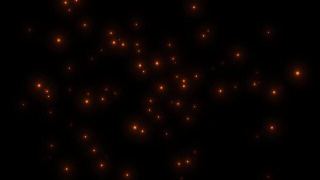 4k Flying bonfire ember sparks in the wintery night sky stock video. Bright glowing fire particles rising fast in a fiery sky with smoke. Seamless loop. Sparks on a black background. Flying bonfire