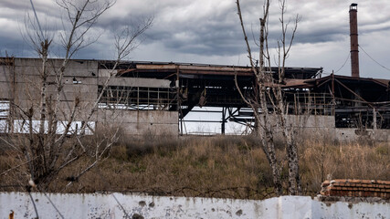 Fototapeta premium destroyed buildings in the industrial zone in Kiev the war in Ukraine