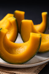 Steamed Japanese pumpkin or Kabocha on plate ready to eating, Healthy food