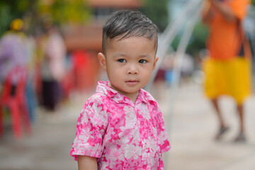 Children playing Songkran use water guns.