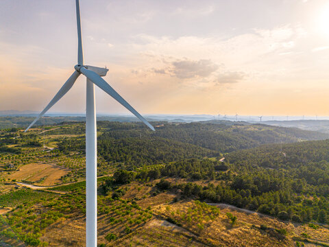 Wind turbine close aerial perspective above farmland in Terra Alta near Horta de San Juan Tarragona Catalonia Spain renewable energy infrastructure for clean electricity and sustainability