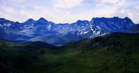 Fototapeta premium A breathtaking view of a mountain range featuring snow capped peaks. The lush valley beneath showcases vibrant greenery under a clear blue sky, highlighting natures beauty.