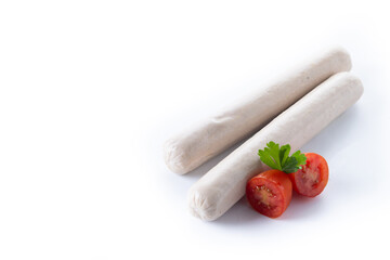 Raw Bratwurst sausages Grilled  with cherry tomatoes and parsley isolated on white background. 
