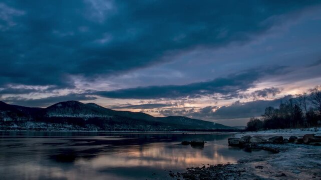 Time lapse clouds in the sunset sky moving background of the Yenisei River in the city of Krasnoyarsk, Siberia, Russia
