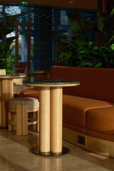 Modern Cafe Interior with Wooden Furniture and Green Plants