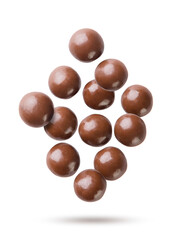 Chocolate balls flying close-up on a white. Isolated