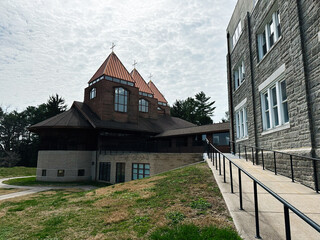 Basilian Spirituality Center church building with red roofs in peaceful Pennsylvania setting under cloudy sky ,Jenkintown, PA