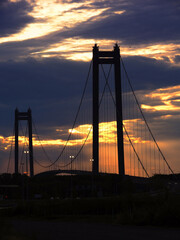 Suspension bridge over Danube River in Braila, Romania at dusk