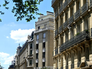 Paris, June 2025 : Visit of the magnificent city of Paris, Capital of France - View on different facades of buildings built by Baron Haussmann