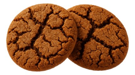 Single ginger snap cookie with a cracked surface on a parchment-lined baking sheet