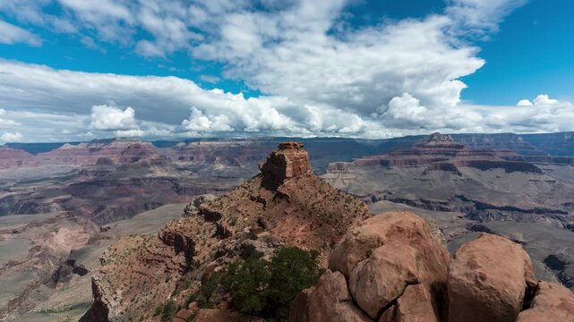 Time lapse of the Grand Canyon national park with blue sky and big clouds over wide landscape