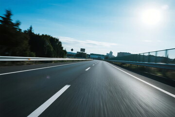 Fototapeta premium Speeding on an empty highway under bright sunlight