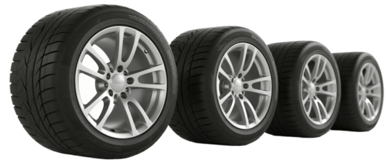 Set of four modern car tires displayed in a row