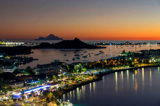 View at night of  the harbor and the bay of Marigot in the Caribbean island of Saint Martin (St Maarten), French West Indies. Saba island in the background