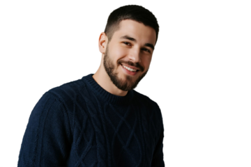 A man wearing a dark blue cable knit sweater and smiling