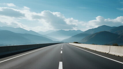A Long Highway Leading Through Mountainous Scenery Under a Clear Sky