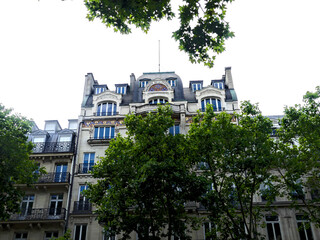 Paris, June 2025 : Visit of the magnificent city of Paris, Capital of France - View on different facades of buildings built by Baron Haussmann