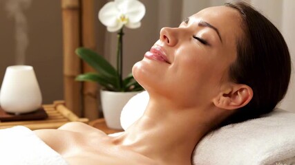 A serene woman enjoying a relaxing spa treatment, surrounded by calming decor, soft lighting, and a soothing atmosphere, promoting wellness and tranquility