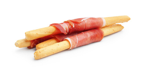 Delicious grissini sticks with prosciutto isolated on white